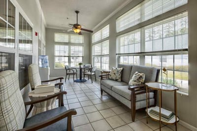 Cozy sunlit common area with seating