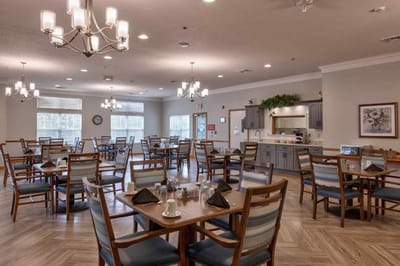 Dining area with tables set for a meal.