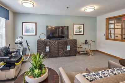Comfortable common area with seating and a television