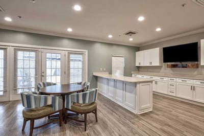 Common area with kitchen and dining table.