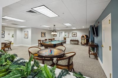 Interior common area with seating and pool table.