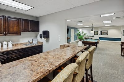 Common area with a kitchenette and recreational space.