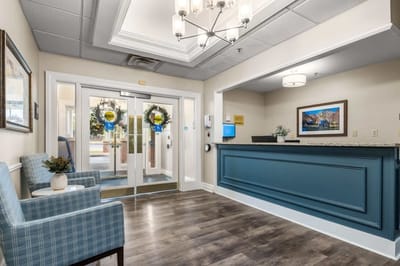 Welcoming lobby area with seating and reception desk.