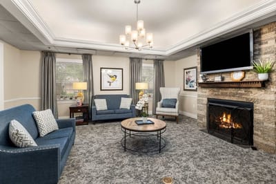 Comfortable common area with seating and fireplace