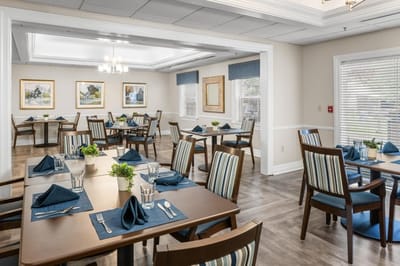 Dining area with tables set for a meal.