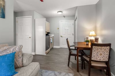 Cozy interior of a resident room with dining area.