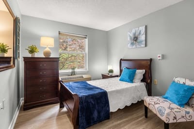 Bright interior view of a resident's bedroom.