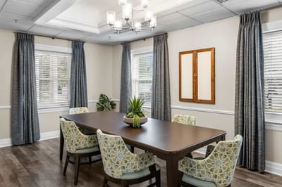 Bright common area with a large dining table