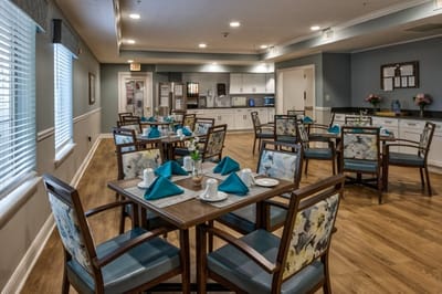 Dining room setup with tables and chairs