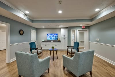Common area with seating and television.