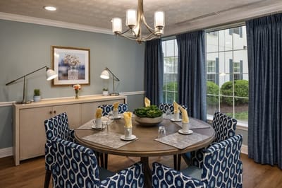 Cozy dining area with stylish decor and seating.