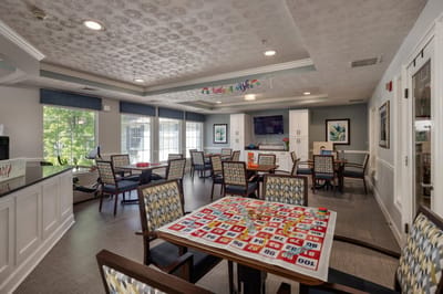 Common area with seating and activity table.