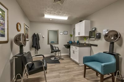 Hair salon area with styling chairs and equipment