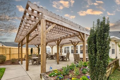Covered outdoor seating area with flowers