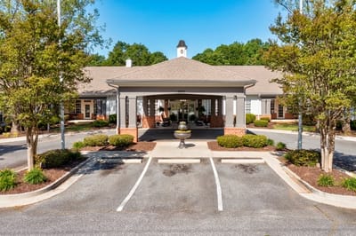 Entrance of TerraBella Northridge facility with landscaped parking area.