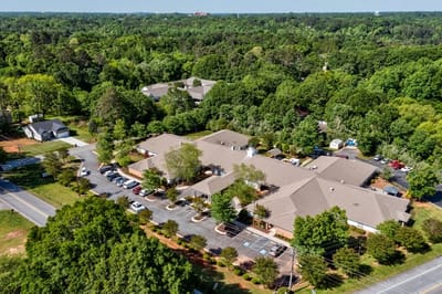 Aerial view of TerraBella Northridge surrounded by trees.