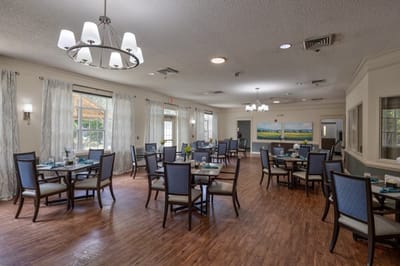 Spacious dining area with tables and chairs.