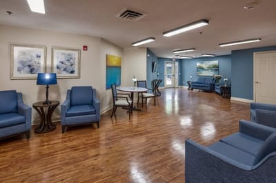 Interior lounge area with comfortable seating and artwork