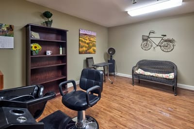 Hair salon area with styling chairs and decor