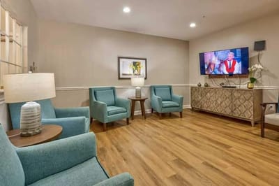 Cozy common area with seating and a TV