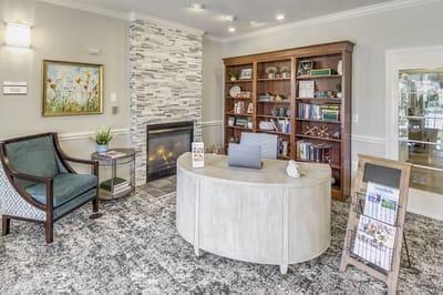 Welcoming interior lobby area with bookshelves and seating.