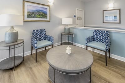 Cozy seating area with decorative lamps and artwork