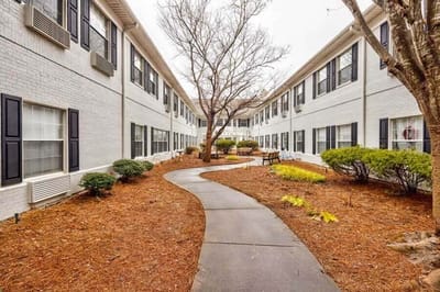 Outdoor walking path with landscaped garden