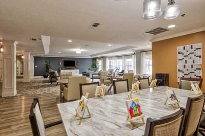 Interior common area with seating and art displays.