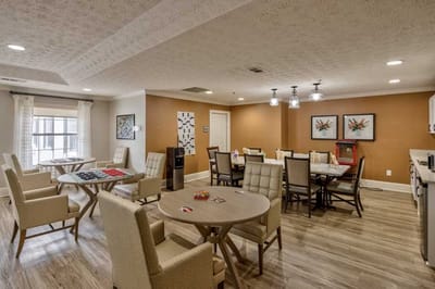 Common area with seating and dining tables.