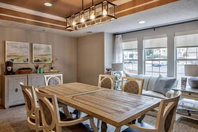 Dining room with large wooden table and chairs