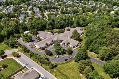 Aerial view of TerraBella Northridge surrounded by trees.
