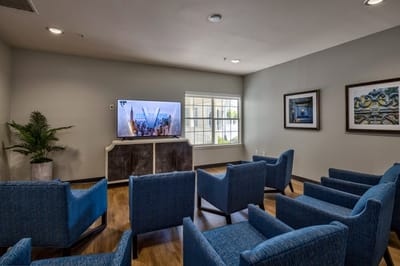 Lounge area with comfortable seating and a TV