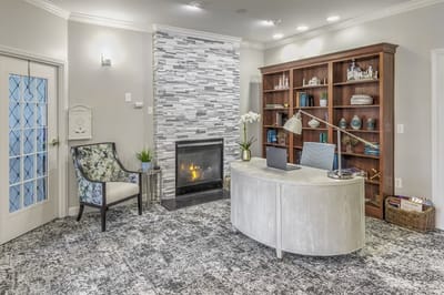 Reception area with a modern design and fireplace.