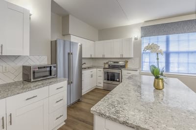 Modern kitchen with granite countertops and appliances