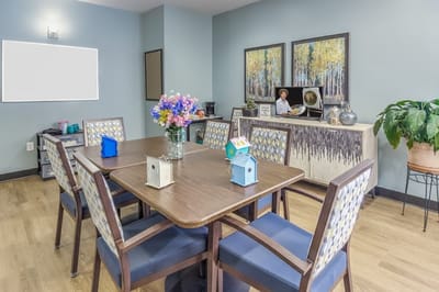 Common area with dining table and decorations.