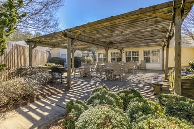Outdoor patio area with seating and shade