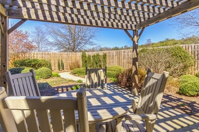 Outdoor patio area with seating and landscaping.