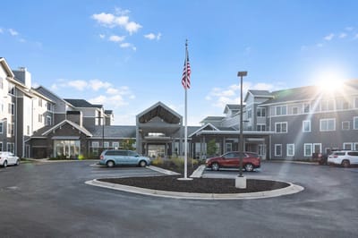 Exterior view of Rivertown Ridge with flag and entrance