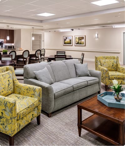 Bright common area with seating and dining space