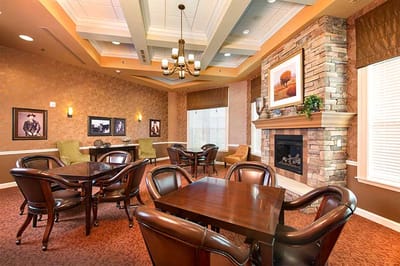 Interior view of a common area with seating and fireplace
