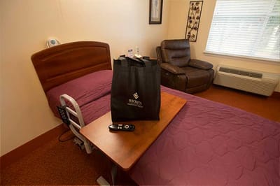 Cozy resident room with personal items and a chair