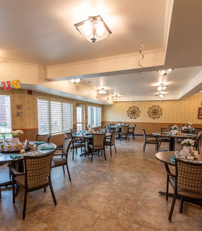 Dining area with tables set up for residents