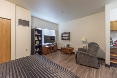 Cozy resident room with a television and seating area