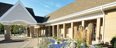 Exterior view of Valley Senior Living facility with landscaping