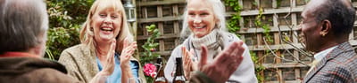 Residents enjoying a cheerful gathering in the garden