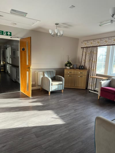 Bright common area with chairs and decor