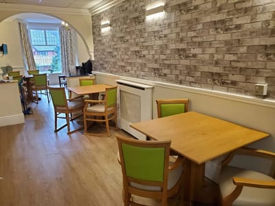Dining area with wooden tables and chairs