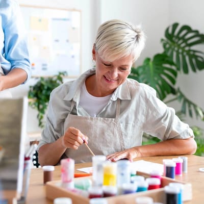 Resident enjoying an art activity