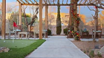 Outdoor garden area with seating and decorations.
