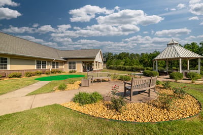 Outdoor seating area with gazebo at the facility.